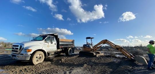 DeSantis Landscapes truck in front of blue sky